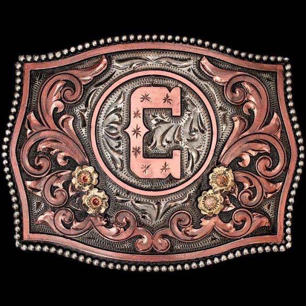 "The Mayfield is a stunnin' buckle to display your initial or ranch brand. Crafted on a hand-engraved, German Silver base with our signature antique finish. Detailed with a beaded German Silver edge, Copper scrolls and Jeweler's Bronze lettering. 

